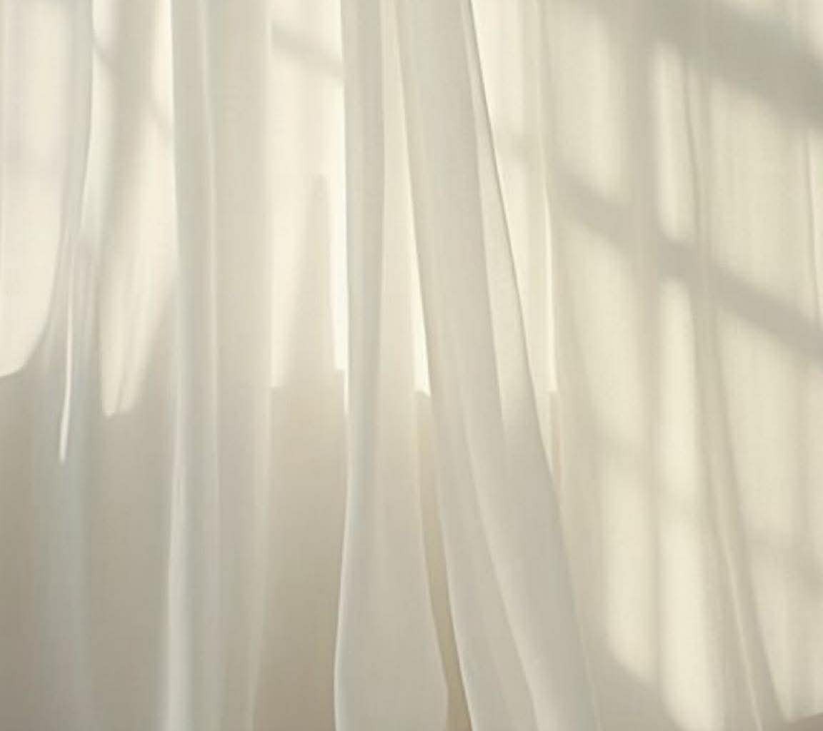 Sheer curtains in the 12:47 Beauty treatment room